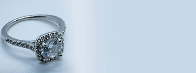macro close-up photo silver diamond ring on white background