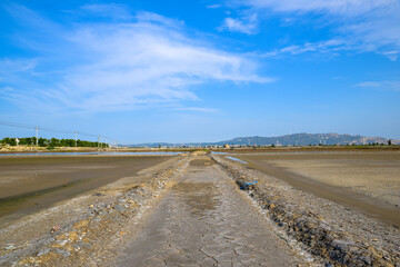 Naklejka premium A road piled up on saline alkali land, a salt pond