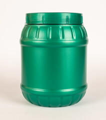 Obraz premium Green plastic jar