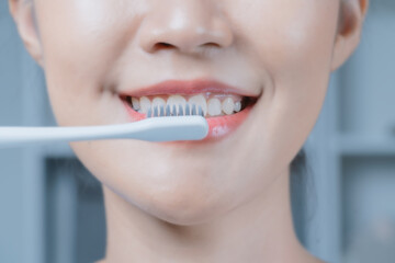 A woman brushing her teeth.Oral and dental health.