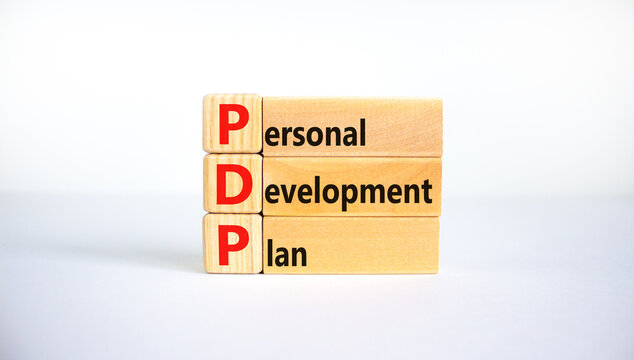PDP, Personal development plan symbol. Words PDP, Personal development plan symbol on blocks on a beautiful white background. Business, PDP, Personal development plan symbol concept. Copy space.