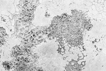 Old cement wall painted white, peeling paint texture and background