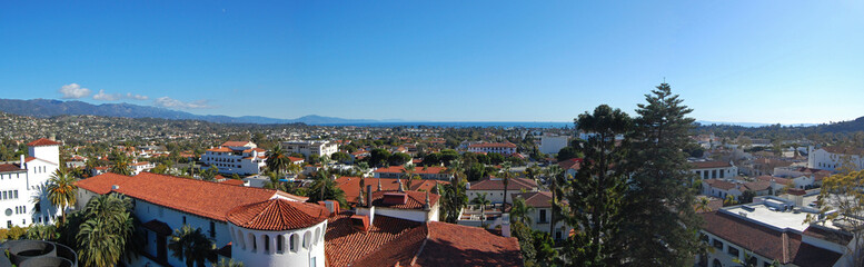 Aerial view of Santa Barbara historic city center with Santa Ynez Mountains at the background, from top of the clock tower of Santa Barbara County Courthouse, California CA, USA. 