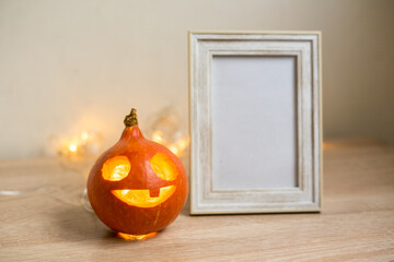 Autumn minimal composition. Thanksgiving holiday concept. Photo frame, pumpkin on white background.