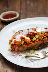Baked sweet potato with barbeque jackfruit