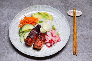 Japanese style meal with grilled salmon, rice and pickled vegetables