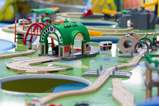 Toy ground with wooden rails trains on playground for children
