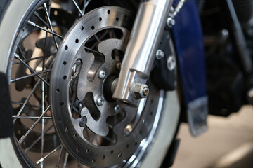 Fototapeta na wymiar Closeup of brake disc on motorcycle wheel