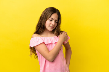 Little caucasian girl isolated on yellow background suffering from pain in shoulder for having made an effort