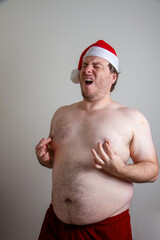 fat santa grabbing his nipples and making funny faces