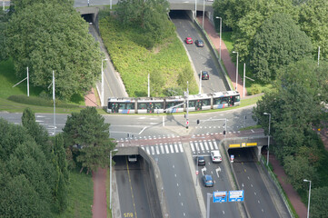 Aerial view of a highway with cars and a tram in the center of Rotterdam in the Netherlands