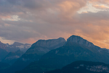 Fototapeta na wymiar Majestic panoramic view of mountains in canton Schwyz with beautiful cloudscape