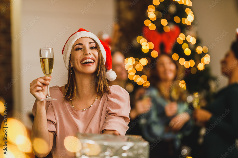 Sticker Woman Making Toast With Champagne And Holding Gift As They Celebrate Christmas At Home Party