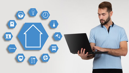 Software engineer is developing smart house system. Man next to IOT home icons. programmer with...