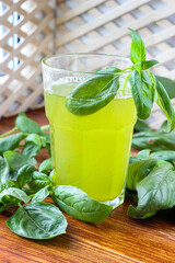 Glass of lemonade made from green basil and lemon - 457186120