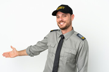 Young security Brazilian man isolated on white background extending hands to the side for inviting to come