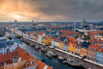Fototapeta na wymiar Aerial view of famous Nyhavn pier with colorful buildings and boats in Copenhagen, Denmark. The most popular place in Copenhagen.