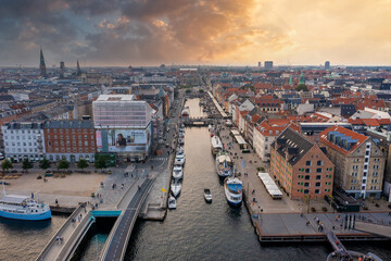 Aerial view of famous Nyhavn pier with colorful buildings and boats in Copenhagen, Denmark. The...