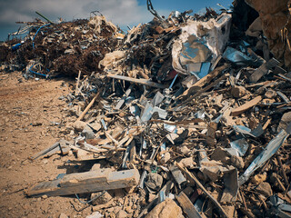 Metal reinforcement rods, lumber and other different kinds of construction debris piled....