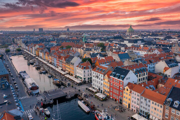 Fototapeta na wymiar Aerial view of famous Nyhavn pier with colorful buildings and boats in Copenhagen, Denmark. The most popular place in Copenhagen.