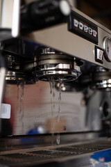 Water flows out of the espresso machine.