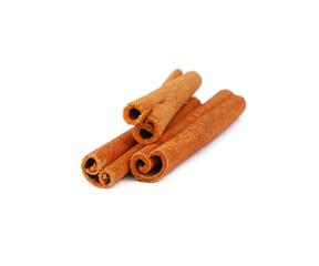 Close up three cinnamon sticks isolated on white
