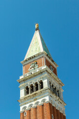 Attic of the bell tower with the lion of Saint Mark and the allegorical figure of Venice as Justice...