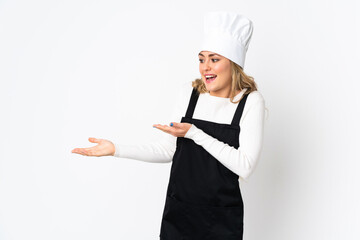 Young Brazilian chef woman isolated on white background with surprise expression while looking side