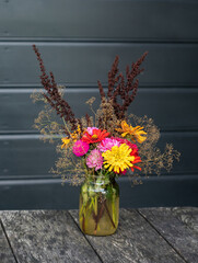 Bouquet of red, orange and yellow autumn flowers