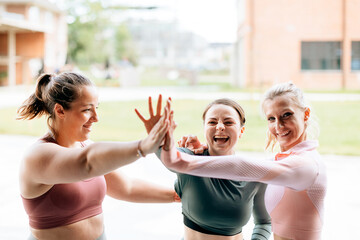 sports team giving high five - collaboration concept - positivity and friendship after training and...