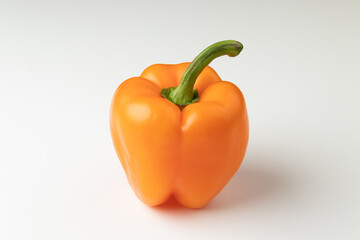 Orange bell pepper isolated on white background