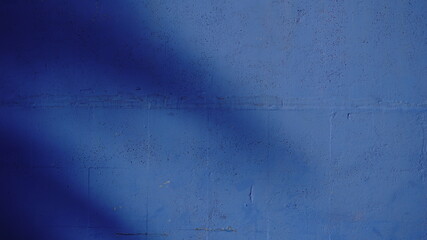 blue wall background with shadows