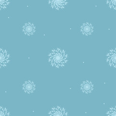 Seamless pattern of snowflakes on a blue background.