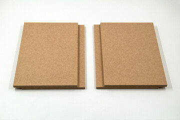 MDF boards symmetrically placed on a white surface.