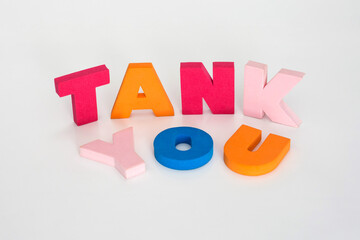 Naklejka premium Word made up of multicolored letters. Tank you