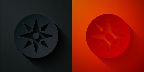 Paper cut Wind rose icon isolated on black and red background. Compass icon for travel. Navigation design. Paper art style. Vector