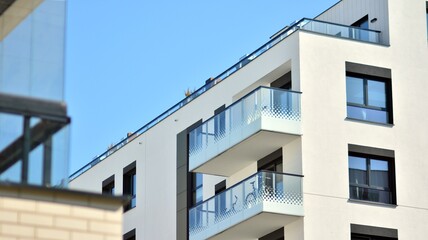 Fototapeta premium Modern apartment building on a sunny day. Architectural details and facade of a modern apartment building.