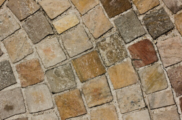 mosaic floor background, with tiles of different colors 