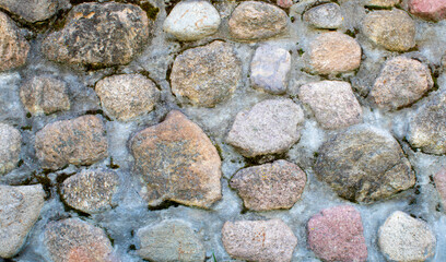 Stone wall texture. Mosaic rocks decorative interior wall background. Masonry wall of old stones