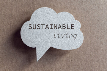 Sustainable living phrase on recycled cardboard speech bubble