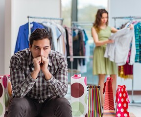 Man waiting for his wife during christmas shopping