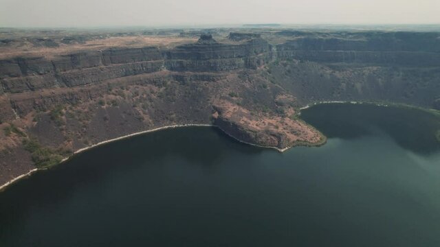 Eastern Washington Desert Canyon Aerial Pan Across Lake Water