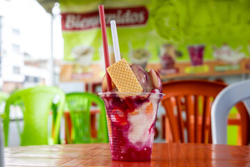 Traditional sweet water ice with fruits called cholado in the city of Cali in Colombia
