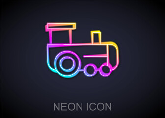 Glowing neon line Toy train icon isolated on black background. Vector