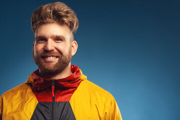 Any weather is okay concept. Emotive portrait of laughing charismatic muscular 30-year-old man...