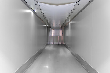 Refrigerated semi-trailer inside. Empty cargo area of refrigerated trailer. Interior of the new...