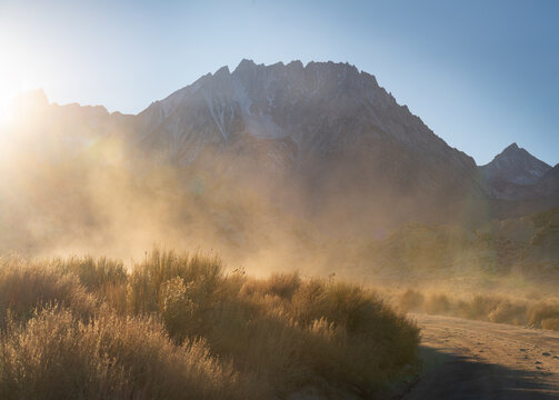 A cloud of dust creates exciting light in the backroads of the Eastern Sierra, California