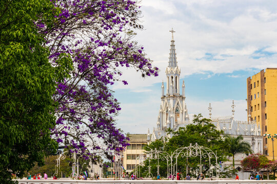 Beautiful church with a spring view, colorful trees and a river running through the city