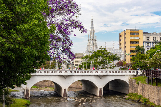 Beautiful church with a spring view, colorful trees and a river running through the city