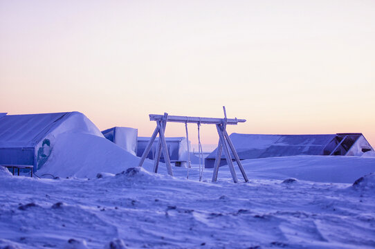 The Arctic Deep Freeze.  Here you see a frozen swing set used by children summering at their family's fish camp.